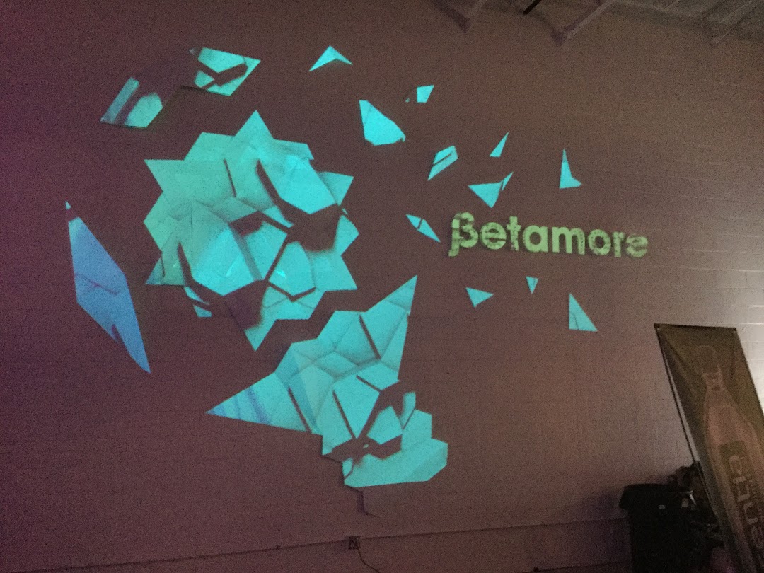 Projection mapped geometric wall with Betamore logo