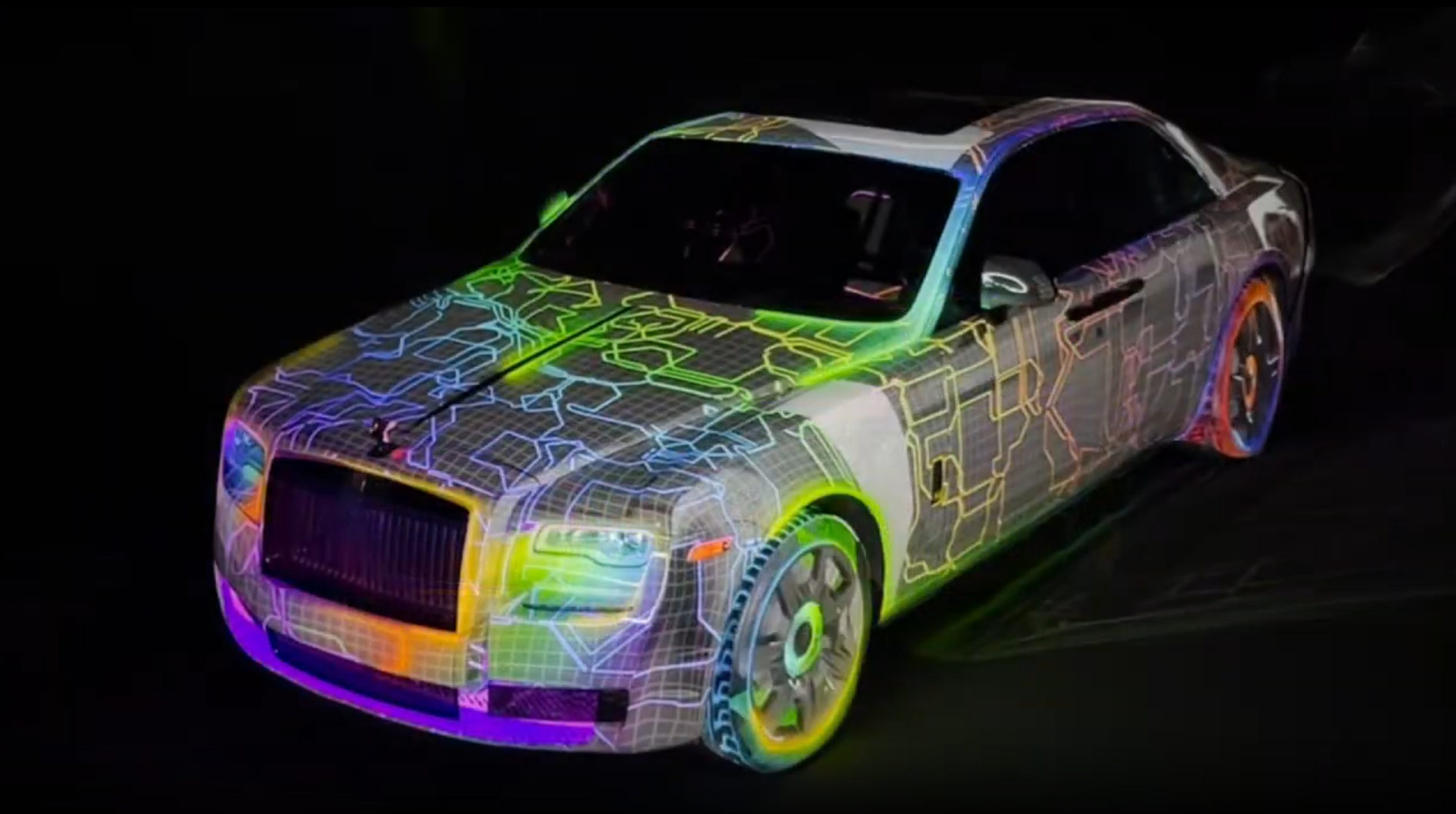 2019 Rolls Royce Ghost covered in a live rainbow neon wireframe projection mapping at the Kyureshon pop-up event
