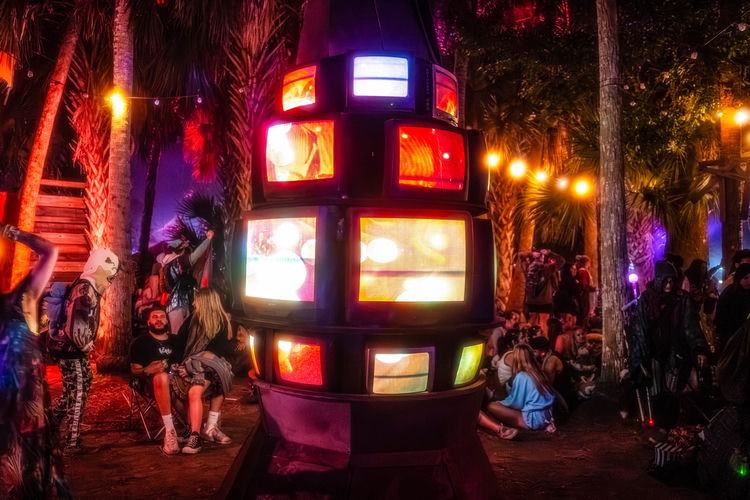 TELAVAVISION illuminated at night - CRT lava lamp glowing in the Okeechobee palms